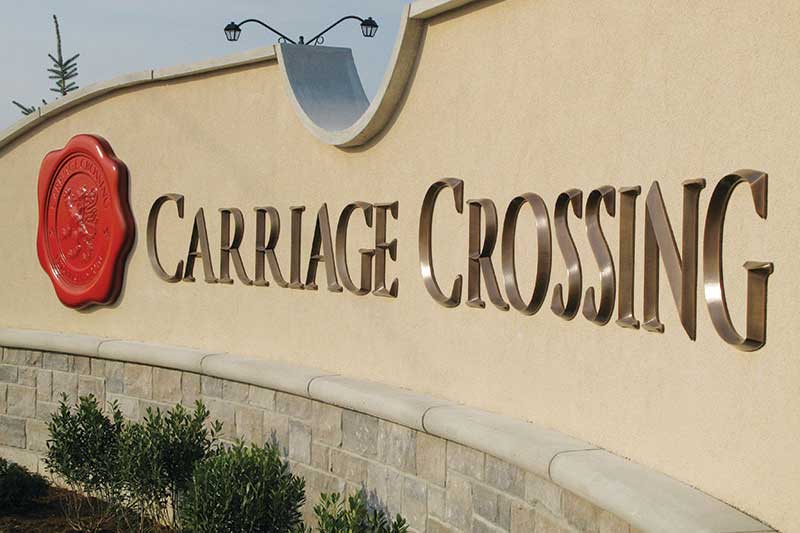 Oxidized Cast Bronze Letters at Carriage Crossing