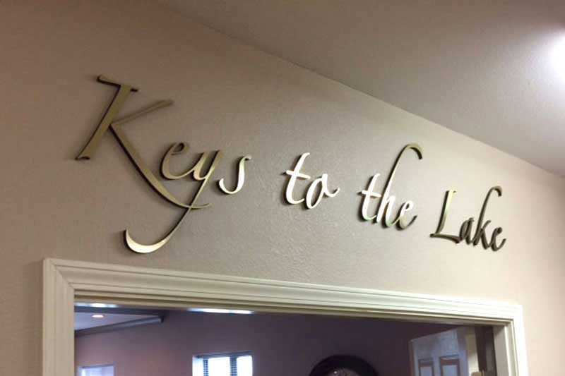 Metal laminated to acrylic for Keys to the Lake office entrance