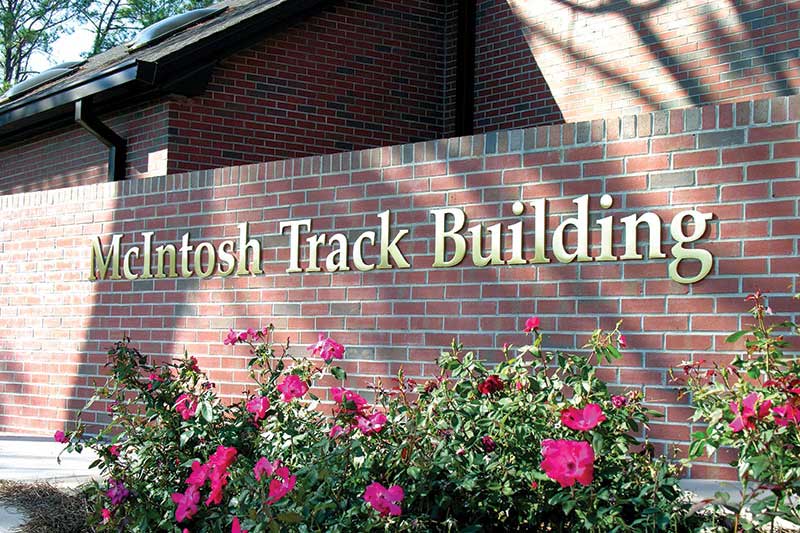McIntosh Track Building sign with solid brass letters